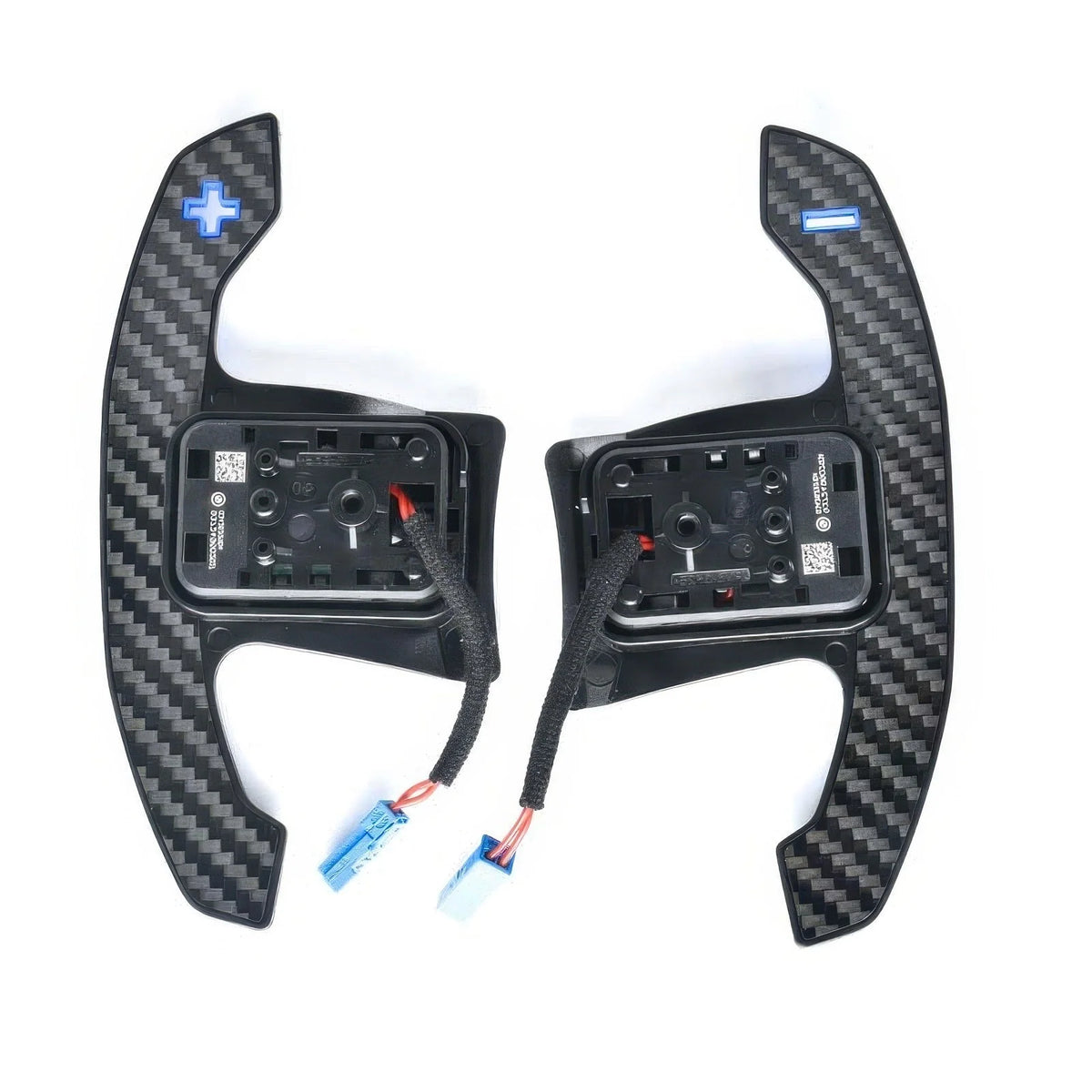 Back of carbon fiber paddle shifters with blue symbols, switch housings and connectors