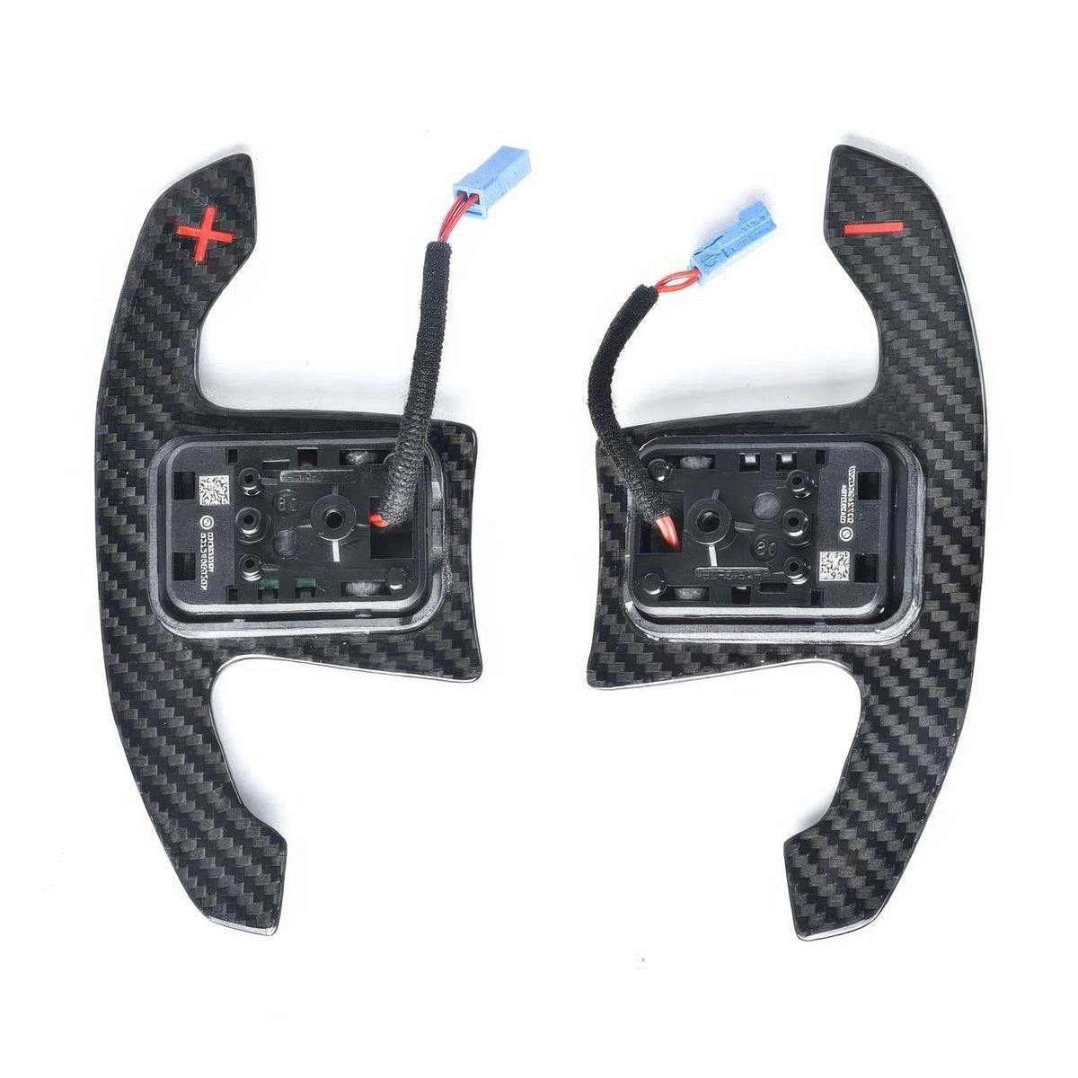 Back of carbon fiber paddle shifters with red symbols, switch housings and connectors